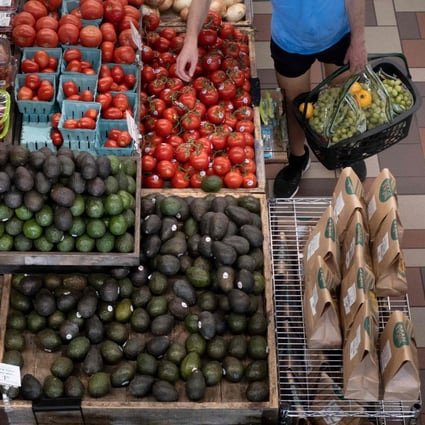 A person shops at a grocery store in Washington DC, on August 12, as a US report showed inflation rising significantly on the back of energy and food prices. Photo: AFP