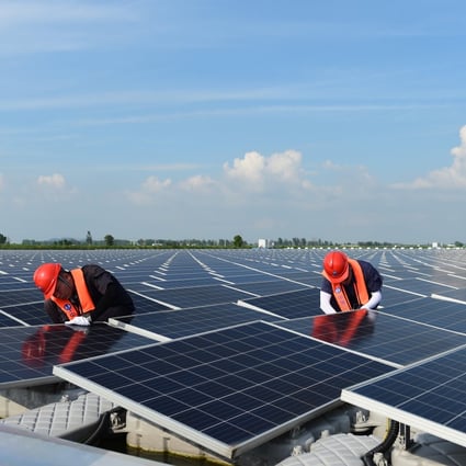 Engineers conduct maintenance work at a floating solar farm in Huainan, in eastern Anhui province. China currently generates around a quarter of its electricity from renewables. Photo: Xinhua
