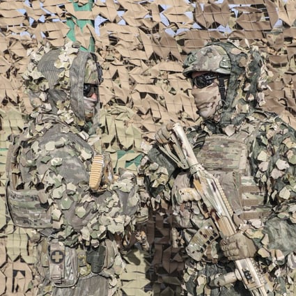 Camouflaged Russian soldiers take part in a joint anti-terrorist exercise with the armed forces of the Shanghai Cooperation Organization member states. Photo: EPA