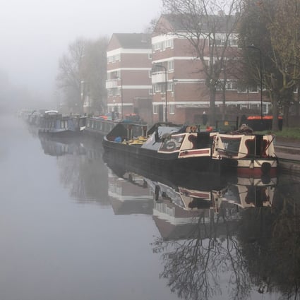 Houseboats moored on Regents Canal, London, the setting for Paula Hawkins’ third novel, A Slow Fire Burning. Photo: Getty Images