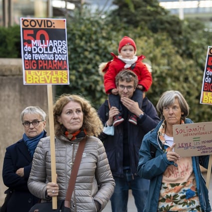 People demonstrate for the cancellation of patents on vaccines against Covid-19, in Geneva, Switzerland, on October 13. This is just one of the issues that could be discussed at the WTO’s ministerial meeting. Photo: EPA-EFE