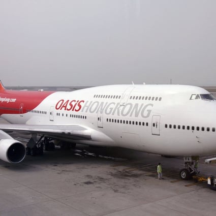 An Oasis Hong Kong Airlines Boeing 747-400 at the departure gate at Hong Kong International Airport before the carrier’s inaugural flight on October 25, 2006. Photo: Reuters  