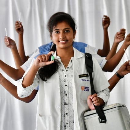 Nursing staff involved in vaccination against Covid-19 pose as goddess Durga at Ramaiah Hospital in Bangalore as they celebrate India administering its billionth vaccine dose on October 21. Photo: AFP