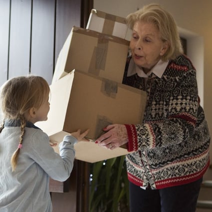 An elderly woman gets help from a grand-daughter to clear up unwanted possessions. In Sweden, death cleaning is common to remove clutter that your relatives would otherwise have to deal with later. Photo: Getty Images
