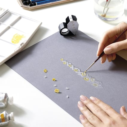 A designer with London jeweller Graff paints a gouache of a pair of earrings from the latest Threads Collection, in which the brand has added yellow diamonds, Colombian emeralds and Royal Blue sapphires. Photos: Graff