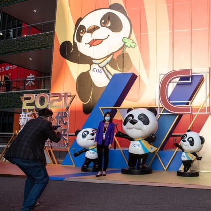 Visitors take photos with Jinbao, the mascot of the China International Import Expo in Shanghai, November 8. Chinese importers inked deals amounting to US$70.72 billion. What evidence here of the xenophobic shunning of foreign goods? Photo: Xinhua