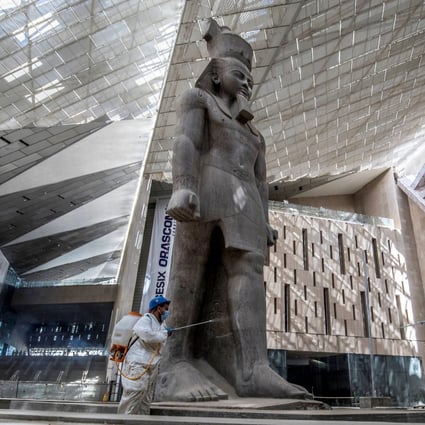 A 3,200-year-old pink-granite colossal statue of King Ramses II at the entrance of the the Grand Egyptian Museum in Giza, Egypt. Set to open in 2022, it is one of a number of new museums around the world. Photo: AFP