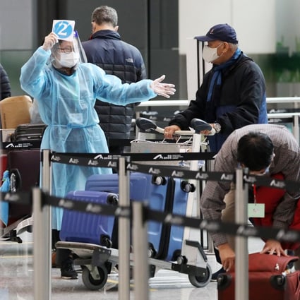 A passenger from London arrives at Hong Kong airport on December 22 last year, after Hong Kong announced a ban on all passenger flights from Britain in bid to stop a mutated strain of Covid-19 from reaching the city. The possibility of flight bans, in addition to lengthy quarantine, makes travel into Hong Kong a journey fraught with pitfalls. Photo: Nora Tam