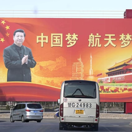 A billboard at the Jiuquan Satellite Launch Centre in Gansu province shows President Xi Jinping with the slogan “Chinese Dream, Space Dream” on October 14. Photo: Kyodo