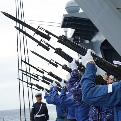 Members of the Japanese Maritime Self-Defence Force helicopter carrier JS Izumo rehearse a memorial ceremony for those who died during World War II. Photo: AP