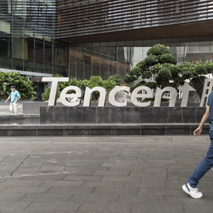 A pedestrian near signage for Tencent Holdings Ltd. at the company’s headquarters in Shenzhen, China, on Tuesday, Oct. 12, 2021. Photo: Bloomberg