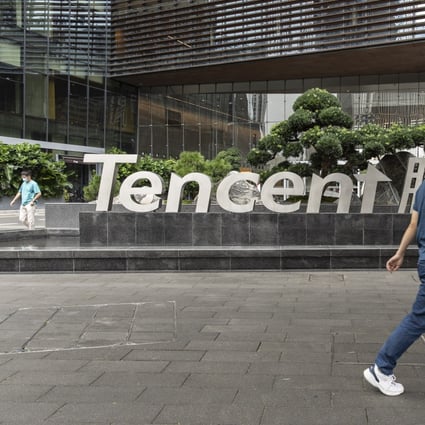 A pedestrian near signage for Tencent Holdings Ltd. at the company’s headquarters in Shenzhen, China, on Tuesday, Oct. 12, 2021. Photo: Bloomberg 
