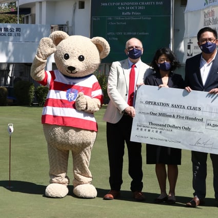 (From left) Hong Kong Golf Club mascot Fanling Freddie, RTHK’s Hugh Chiverton, lady captain Jane Lo, captain Clarence Leung, Trade Development Council chief Peter Lam and charity committee chairman William Doo Jnr at the golf club in October. Photo: Jonathan Wong