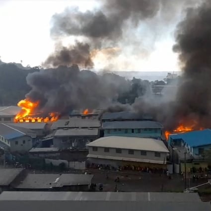 Rioters torched buildings in the Chinatown district in Honiara on Thursday. Photo: ZFM Radio/AFP