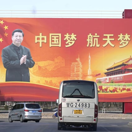 Chinese President Xi Jinping is seen on a billboard with the slogan “China dream. Space dream” at the Jiuquan Satellite Launch Centre in Gansu province on October 14. Photo: Kyodo