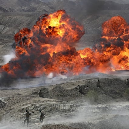 Iranian soldiers take part in a military exercise earlier this month in southern Iran. Photo: Handout via EPA