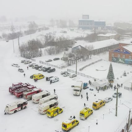 Ambulances and fire trucks are parked near the Listvyazhnaya coal mine in Siberia on Friday. Photo: Governor of Kemerovo region press office photo via AP
