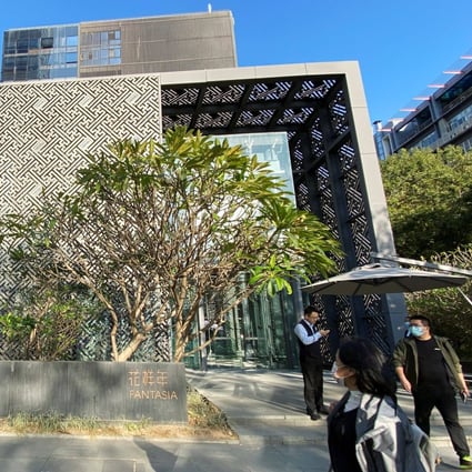 People stand outside the headquarters of Chinese developer Fantasia Holdings in Shenzhen, Guangdong province. Photo: Reuters