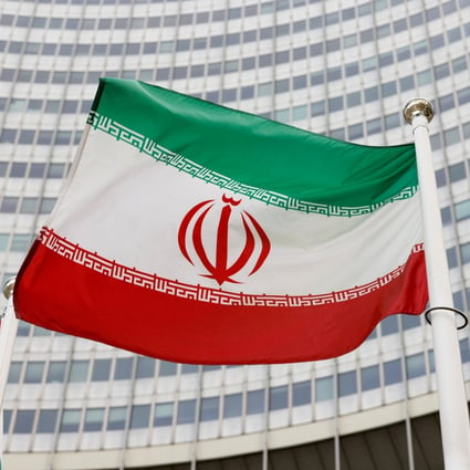 Iran’s flag is seen in front of the International Atomic Energy Agency’s headquarters in Vienna. Photo: Reuters