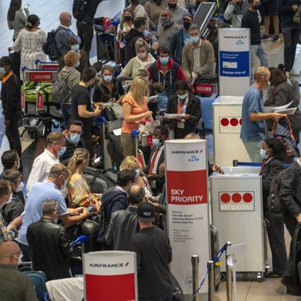 People line up to get on an Air France flight to Paris from Johannesburg on Friday as the WHO labels Omicron a variant of concern. Photo: AP
