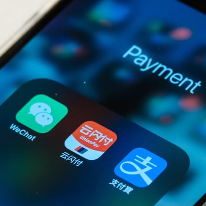 WeChat, Uniopay and Alipay mobile app icons are seen on an iPhone. Photo: SCMP Pictures