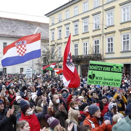 People take part in a demonstration in Graz, Austria on Saturday against the government’s coronavirus measures. Photo: APA / DPA