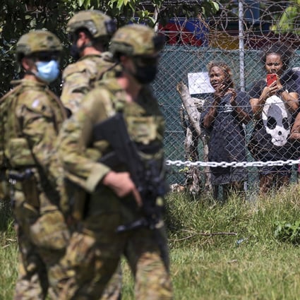 Australian soldiers and police patrol the streets in Honiara, Solomon Islands. Photo: AP 