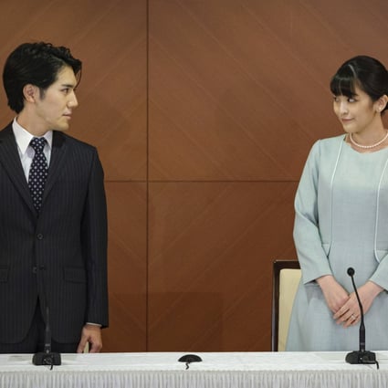 Japan’s ex-princess Mako (right) and her husband Kei Komuro during a conference to announce their marriage on October 26, 2021. Before this announcement, the palace said that she had been diagnosed with post-traumatic stress disorder (PTSD). Photo: AP