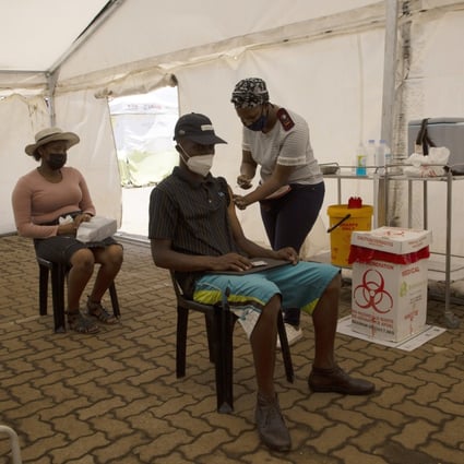 A man receives a dose of a Covid-19 vaccine at a vaccine centre, in Soweto on Monday, as South Africa deals with an increase in coronavirus cases. Photo: AP