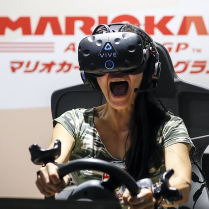 Theme parks are leading the way in the next stage of augmented reality as they embrace the metaverse concept. A visitor wearing VR goggles shouts as she enjoys Mario Kart VR in Tokyo, Japan. Photo: EPA/Kimimasa Mayama 