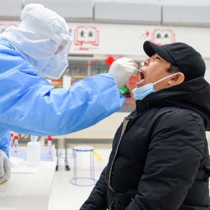 A resident in Manzhouli, north China’s Inner Mongolia Autonomous Region, receives a nucleic acid test on November 29, 2021. China is on alert for signs of the newly discovered Omicron variant, which an expert says is likely to enter the country. Photo: XInhua