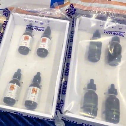 Police display bottles of CBD products that were seized after being found to contain traces of THC. Photo: Facebook
