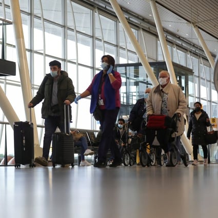 People walk inside Schiphol Airport after Dutch health authorities said that 61 people who arrived in Amsterdam on flights from South Africa tested positive for Covid-19. Photo: Reuters