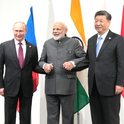 Russian President Vladimir Putin (left), Indian Prime Minister Narendra Modi (centre) and Chinese President Xi Jinping meet on the sidelines of the G20 summit in Osaka, Japan, on June 28, 2019. While India has been drawing closer to the US, it has signalled its support of China hosting the Winter Olympics and continues to buy military equipment from Russia. Photo:Reuters