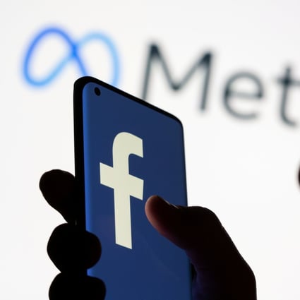 A smartphone with the Facebook logo is seen in front of the Meta logo in this illustration picture taken October 28, 2021. Photo: Reuters