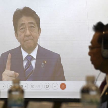 Former Japanese prime minister Shinzo Abe appears  on screen at the meeting in Taipei on Wednesday. Photo: AP