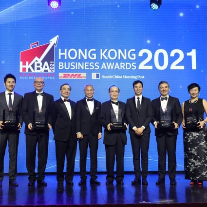 Group photo of DHL / SCMP Hong Kong Business Awards 2021 (L to R) Stanley Kwok, Co-Founder of KnitWarm Limited; Ronald Chan Yik-long, Executive Director, Chairman of the Board, and General Manager of MDLCL, Modern Dental Group Limited; Donald Choi, Executive Director and CEO of Chinachem Group; Professor Richard Wong, Provost and deputy vice-chancellor, Chair of Economics, The University of Hong Kong; Ng Chee-choong, Senior Vice President & Managing Director, DHL Express Hong Kong and Macau; Kenneth Lo, Chairman of the Board and Executive Director of Crystal International Group Limited; Gary Liu, CEO of South China Morning Post; Sebastian Paredes, Chief Executive Officer of DBS Hong Kong; Sammi Hung, Regional Head, Shanghai Fosun Pharmaceutical (Group) Company Limited; Benny Liu, Founder & CEO of HK Decoman Technology Limited, at Grand Hyatt Hotal in Wan Chai. 02DEC21. SCMP / May Tse