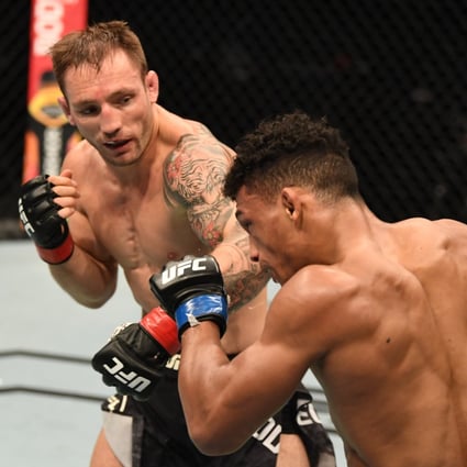 Brad Riddell of New Zealand punches Alex da Silva of Brazil in their lightweight bout during UFC 253 in Abu Dhabi. Photo by Josh Hedges/Zuffa LLC