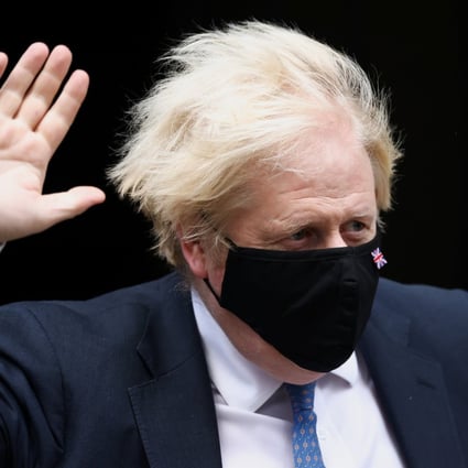 UK Prime Minister Boris Johnson gestures as he walks outside Downing Street in London on Wednesday. Photo: Reuters