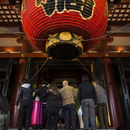 Tourists in the pre-Covid era wait to enter the Sensoji temple in the Asakusa district of Tokyo, Japan. Photo: Bloomberg
