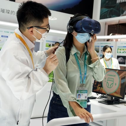A visitor experiences a virtual reality headset at the 4th China International Import Expo in Shanghai last month. Photo: Xinhua