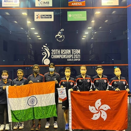 The Hong Kong women’s team and India pose for a photo before the match. Photo: Hong Kong Squash