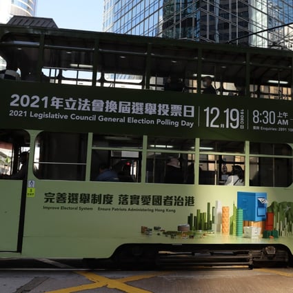 A tram bearing an advertisement for this month’s Legislative Council poll passes through Central. Photo: Nora Tam