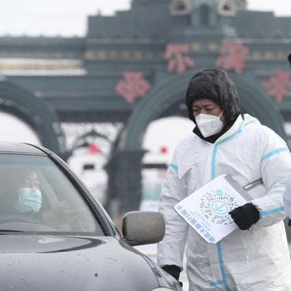 Officials check a motorist’s details in Harbin, where seven new cases were reported. Photo: Xinhua