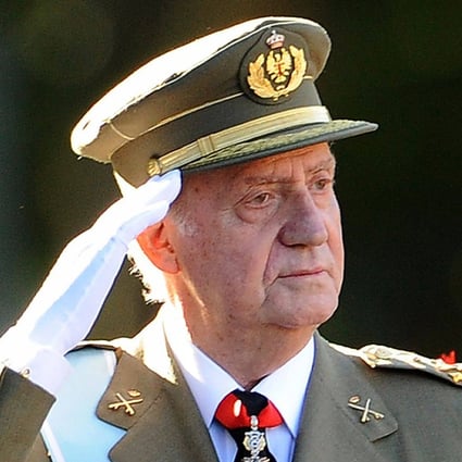 Then Spanish King Juan Carlos salutes the Royal Guard at a parade in Madrid in October 2011. Photo: AFP