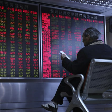 An investor monitors stock prices at a brokerage in Beijing in February 2019. Photo: AP