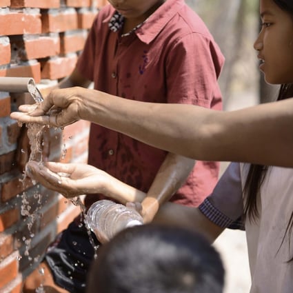 Locals from the Cambodian village of Sneung, on the outskirts of Battambang, collect clean water from WaterHall, designed by Hong Kong architects Magic Kwan and Kenrick Wong. The project won the pair the grand award for sustainability in this year’s DFA Awards.