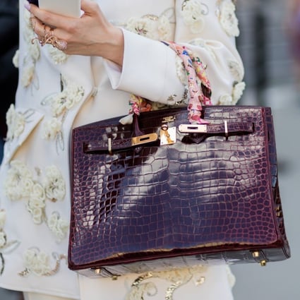 A guest with an Hermès Birkin bag outside Ralph & Russo during Paris Fashion Week in July, 2017. The coveted bag is hard to find and to buy. Photo: Getty Images