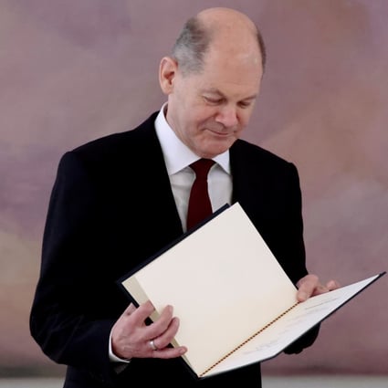 Newly-elected German Chancellor Olaf Scholz receives his certificate of appointment from German President Frank-Walter Steinmeier. Photo: Reuters
