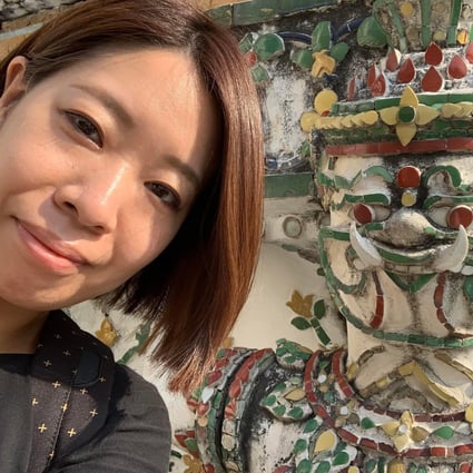 Shiori Kumagai from Japan at Wat Arun in Bangkok. Compared to her first visit nine years ago, attractions were empty - good for photo taking, she says. Kumagai is in Thailand to work remotely. Photo: Thomas Bird